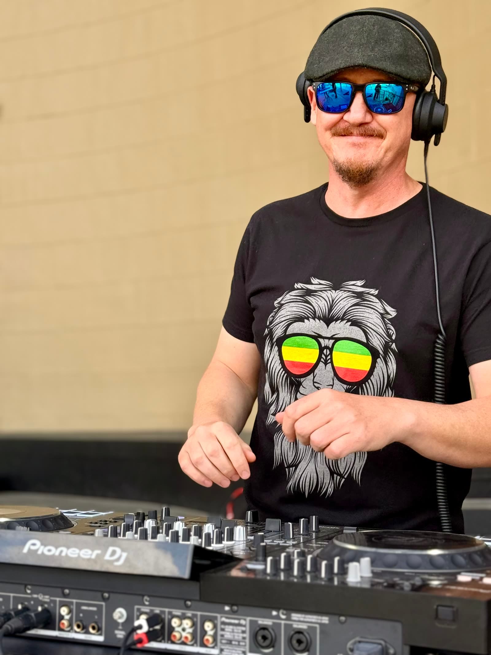 DJ LP Chillen mixing at an outdoor event setup