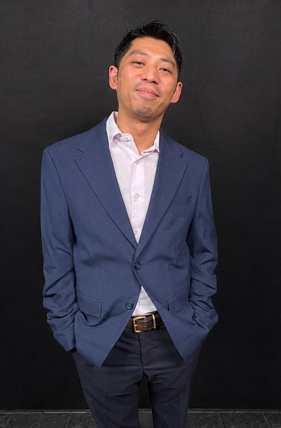 Phil Chua, DJ Chicken Skratch, in a blue suit